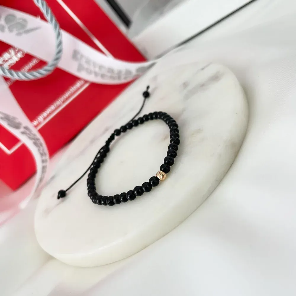 products/650/bratara-barbateasca-onix-si-biluta-aur-4-mm-102970.webp